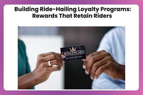 Two people holding a black loyalty card with the text 'LOYALTY CARD' in focus, against a blurred background.